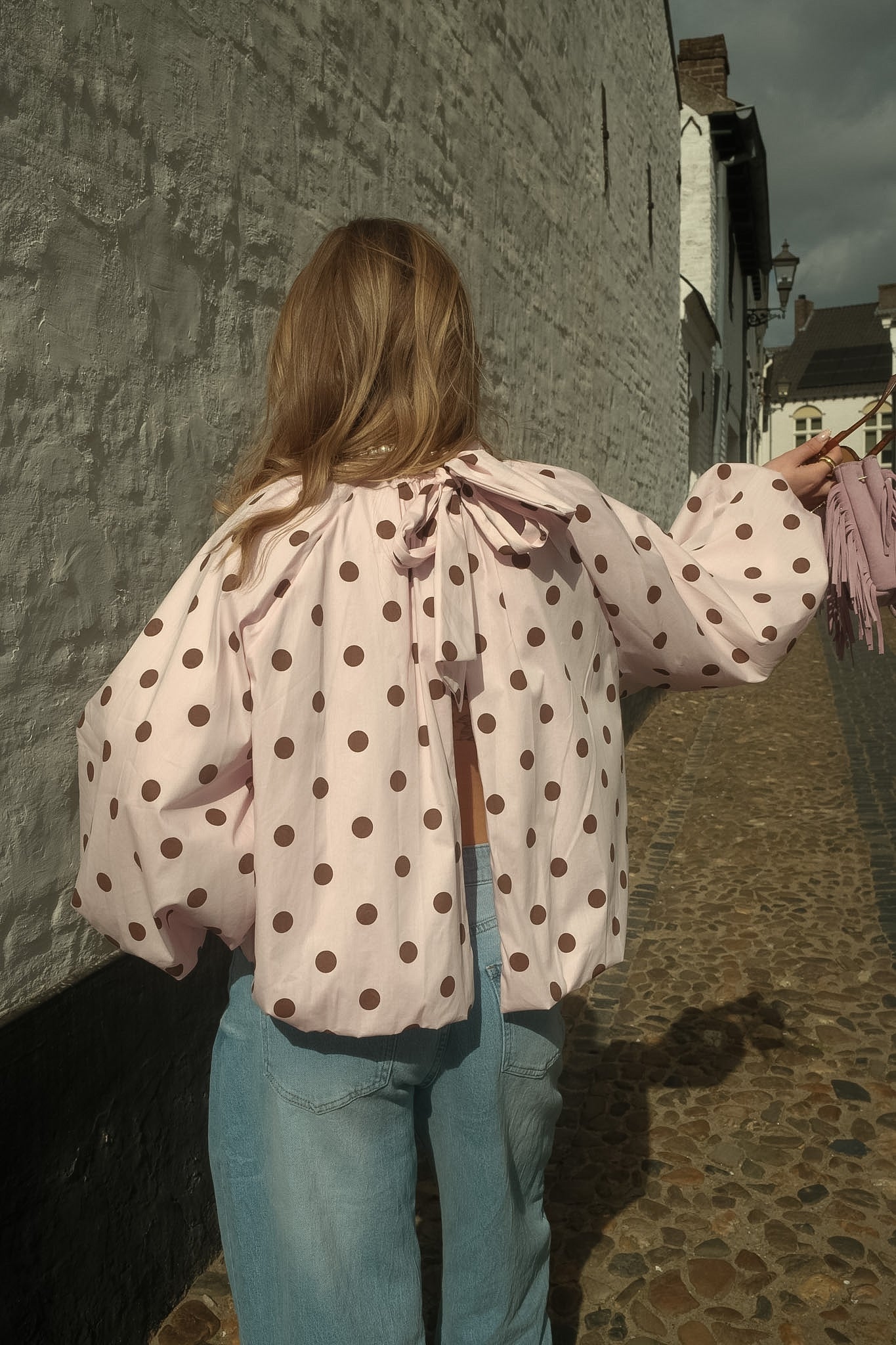 High-Neck Blouse with Open-Back Detail and Relaxed Fit