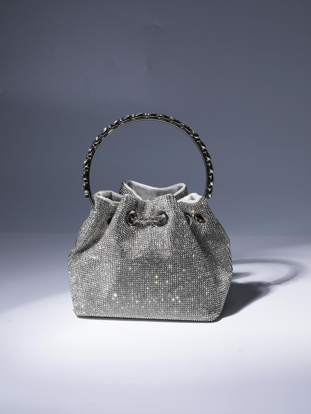 Crystal Embellished Silver Bucket Bag with Drawstring Closure and Top Handle